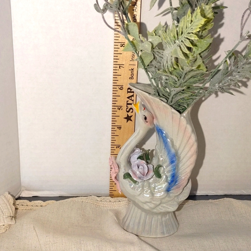 A graceful iridescent Swan vase.